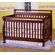 DaVinci Emily 4-in-1 Convertible Crib with Toddler Rail in Cherry