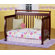 DaVinci Emily 4-in-1 Convertible Crib with Toddler Rail in Cherry
