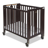Hideaway Compact Sized Folding Crib in Antique Cherry