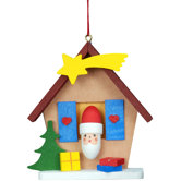 Santa in House with Comet Ornament