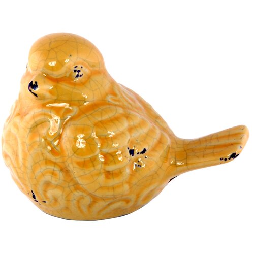 yellow ceramic bird figurine